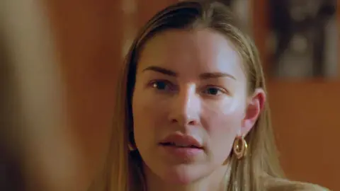 Zara McDermott listen to a victim during an interview for To Catch a Stalker