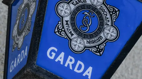 Getty Images Close shot of blue Garda sign with badge