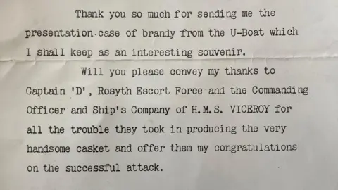 An old type written note thanking the crew for the brandy from a German U-boat. Churchill says it will be kept as an 'interesting souvenir'.