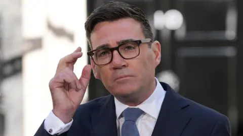 Britain's new Prime Minister Andy Burnham speaks to staff and media at 10 Downing Street in London, Monday, July 20, 2026