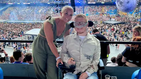 Family photo Alex and Declan at the Etihad Stadium in Manchester ahead of seeing The Weeknd