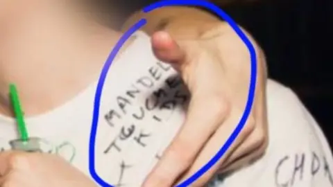 @LeonShakaFraser/Twitter A T-shirt making a comment about Mandela