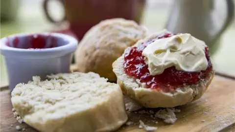 Getty Images Scone with jam and cream