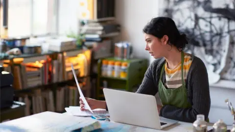 Getty Images Woman sitting at laptop