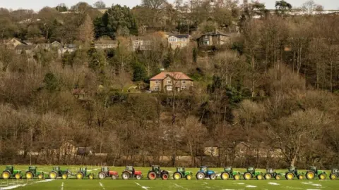 Danny Lawson/PA Tractors line up in Knaresborough