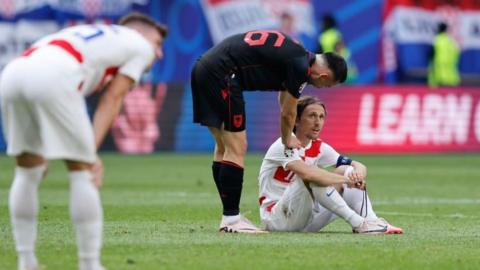Croatia's Luka Modric is consoled after his side's draw with Albania