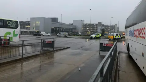 Tony Fisher/BBC Police vehicles at London Luton Airport