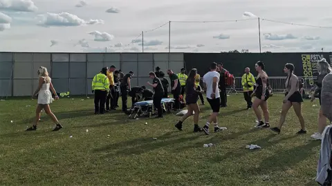 Anna Sophia Alrdige Medical staff help festival goers onto a stretcher