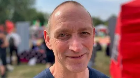 Andrew Sinclair/BBC A close up of Steve O'Donnell who is smiling and looking directly at the camera