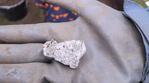 Carenza Lewis A view of fire-cracked flint, as distinguished by its characteristic milky colour. 
