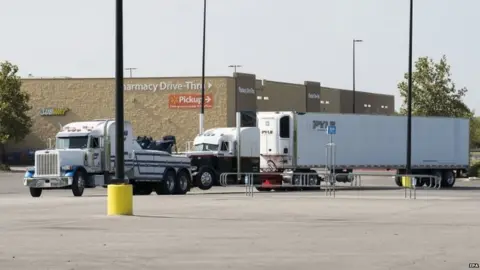 EPA Officials tow a truck that was found to contain 38 suspected illegal immigrants in San Antonio, Texas, USA, 23 July 2017.