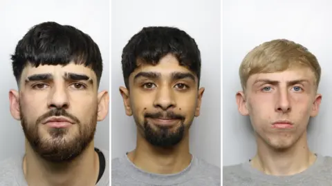 West Yorkshire Police Police mugshots of Leyton Davies, Adam Ahmed and Marc Carter. Davies has medium-length black hair with a slit in his eyebrows and dark facial hair. Ahmed has black hair and a black goatee. Carter has blonde hair and blue eyes.
