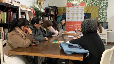 Juan Dominguez Migrant workers attend a free class at Aculco, an organisation that advises them on legal and work issues