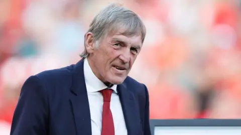 Sir Kenny Dalglish attending a Liverpool game in the Premier League