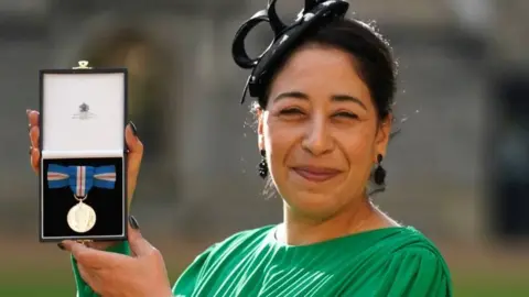 Aaron Chown Ayette Bounouri with her Queen's Gallantry Medal