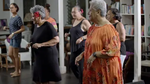 The Samoan PM (right) and friends have a salsa class