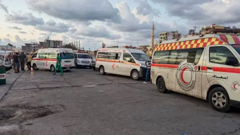 Reuters Emergency vehicles taking part in rescue efforts