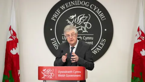 Getty Images Mark Drakeford during a briefing in the Covid pandemic