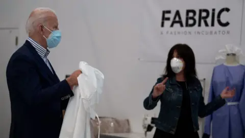 Getty Images Biden tours a fabric company making PPE