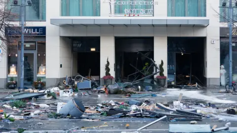 Reuters /Michele Tantussi Image of the front of the Radisson Blu hotel showing a large amount of debris which has been washed into the street