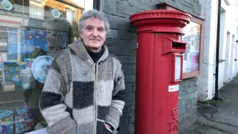 BBC Graham Livesey outside his Post Office branch