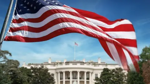 Getty Images File image of a US flag in front of the White House