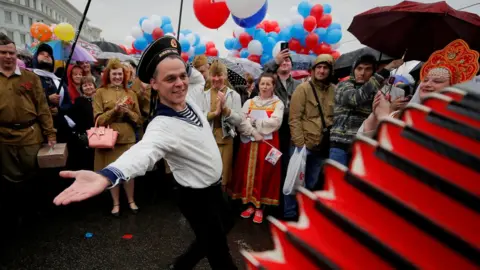 Reuters A man wearing a navy uniform performs before a May Day rally in central Moscow, Russia May 1, 2018.