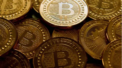 AFP/Getty Images Bitcoin medals.