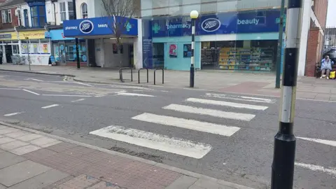 Zebra crossing on St Peters Avenue, Cleethorpes, there are shops on the opposite side of the road