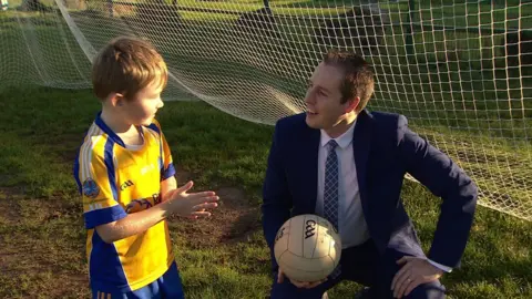 A keen soccer player, it was the first time the sports minister had kicked a Gaelic football