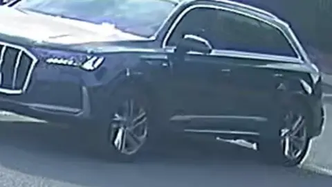 CCTV Stolen car captured on CCTV. It is large and black.