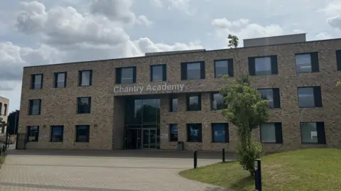 The main entrance to Chantry Academy, a three-storey brick building