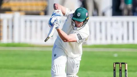 Worcestershire's Dan Lategan (in green batting helmet) plays an shot on the leg side