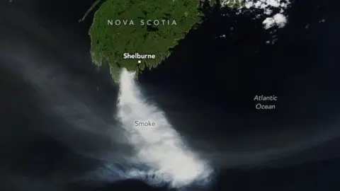 NASA Earth Observatory/ISS Crew Earth Observations An image taken from the International Space Station showing a large cloud of smoke travelling down from the southern tip of Nova Scotia.