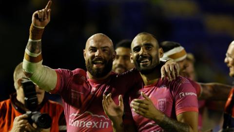 Sam Luckley and Tyrone May celebrate victory at the Halliwell Jones Stadium
