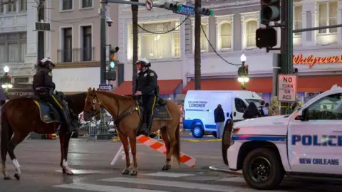 Getty Images The scene at the intersection of Bourbon Street and Canal Street remains cordoned off by police