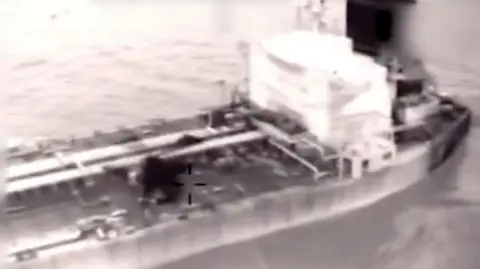 A screengrab of the video shows US forces boarding the oil tanker linked to Venezuela