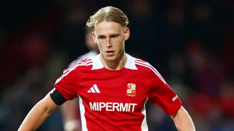 Finley Munroe in action for Swindon Town during the 2025-26 season.