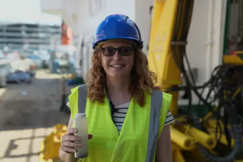 Gwyndaf Hughes/BBC Stephanie Henson on the deck of a research vessel