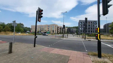 The crossing, with the new Barton development in the background.