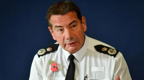 PA Media Nick Adderley in police uniform