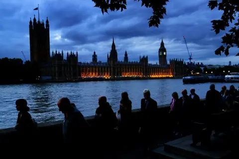 Victoria Jones Members of the public stand in the queue on the South Bank