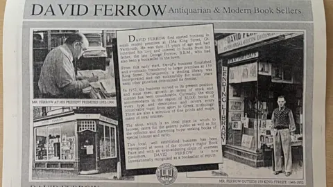 Emma Craig/BBC A black and white newspaper clipping about David Ferrow, featuring photos of him and his book shop.