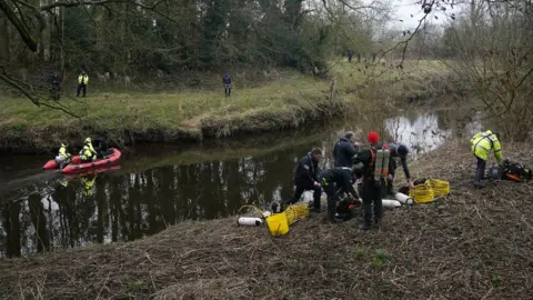 PA Media Police search teams near the River Wyre