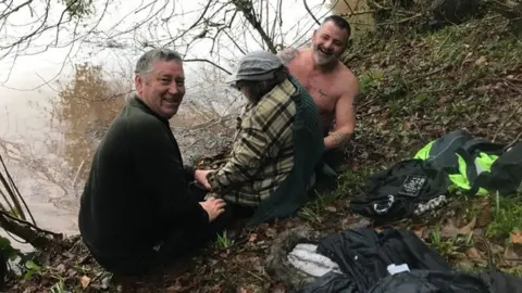 Geoff Handley Rescuing woman