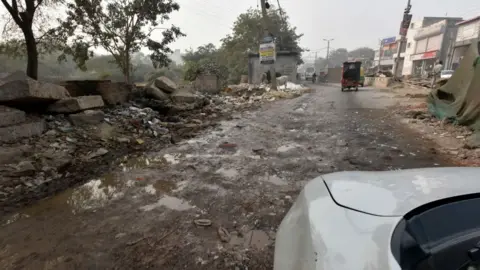 Getty Images A view of bad road of Sultanpuri to Kanjhawala where the woman's scooter was found