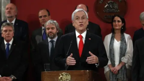 Getty Images President of Chile Sebastian Piñera announces changes in his cabinet at Palacio de La Moneda on October 28, 2019 in Santiago