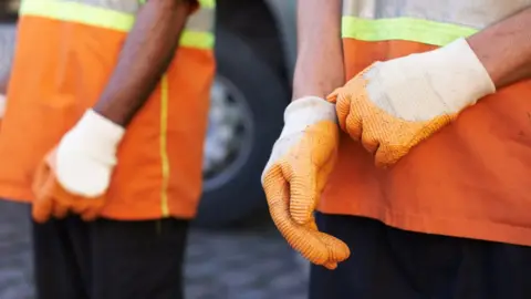 Getty Images Waste removal staff