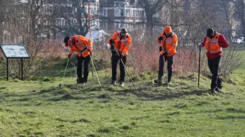 PA Media Volunteers from London Search and Rescue help search Clapham Common