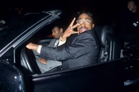 WireImage via Getty Images Here Shakur (right) is seen with Snoop Dogg at the 23rd annual American Music Awards in January 1996
